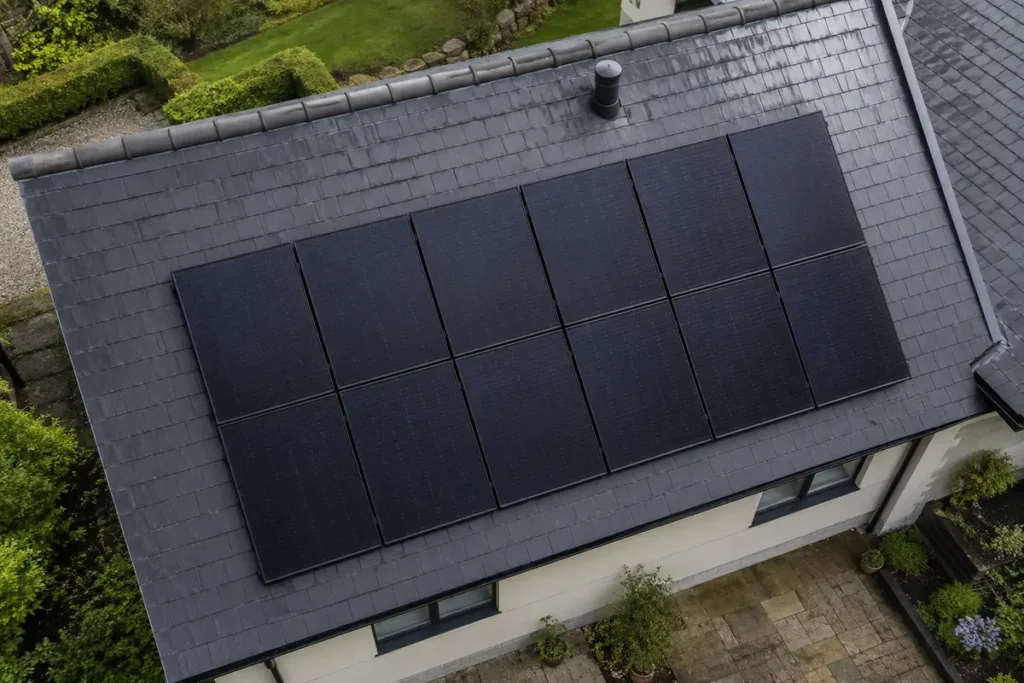 Aerial view of modern solar panels installed on an Irish slate roof.